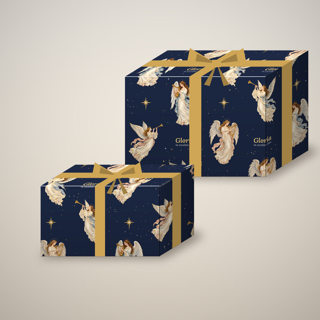 Gloria in excelsis Deo angel Christmas wrapping paper on two wrapped gift boxes with a bow